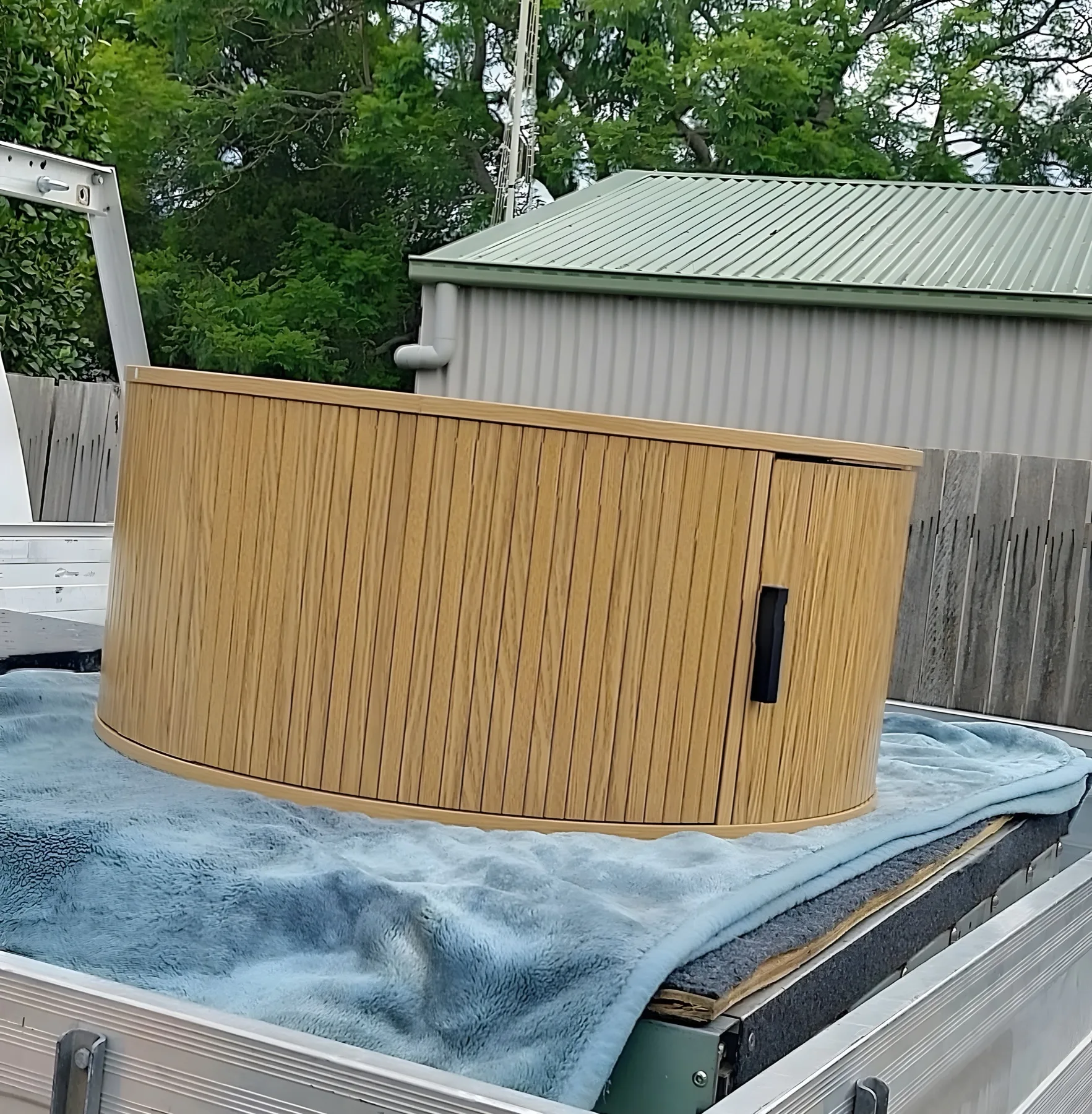 Timber cabinet strapped down on the LKB Domestic ute tray